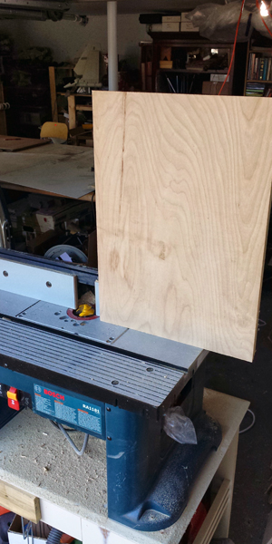 Run the small, easer to handle, front panel through the cutter vertically.
